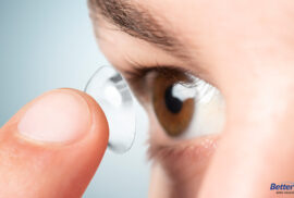 Woman putting on Ortho-K lenses for Better Vision